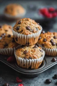 Chocolate chip protein muffin stacked in a tin
